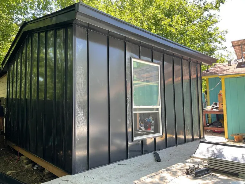 Black standing seam metal wall panels for Roof Inspection in Monett